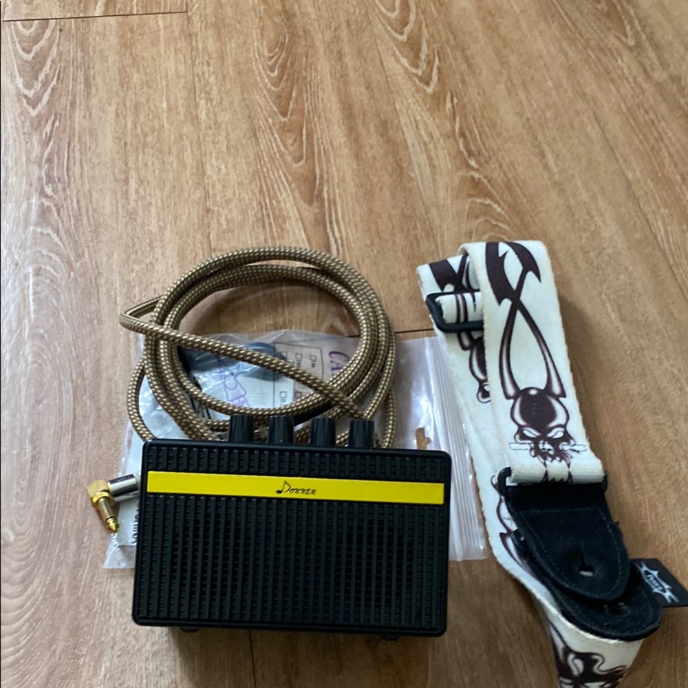 Mini Guitar Amp. Rechargeable with cables and guitar strap